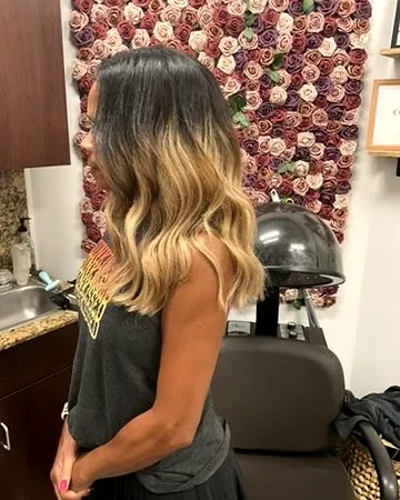 Dimensional balayage color on curly hair.