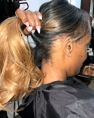 Sleek extension detail pulled into a high ponytail.