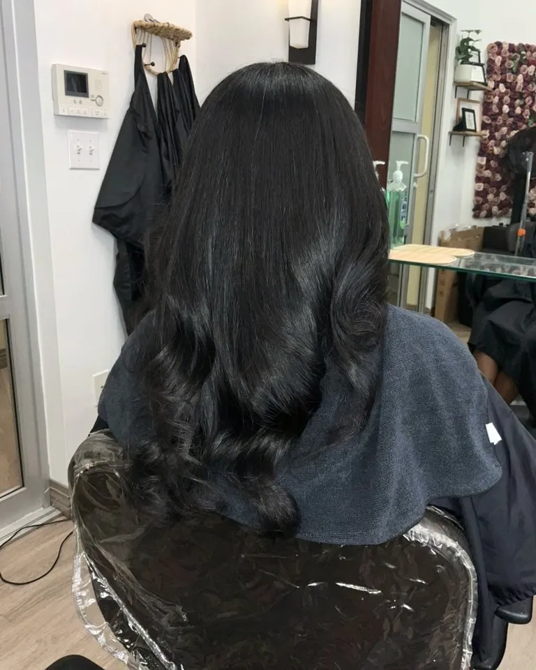 A finished silk press by Crystal Belle — length and shine.